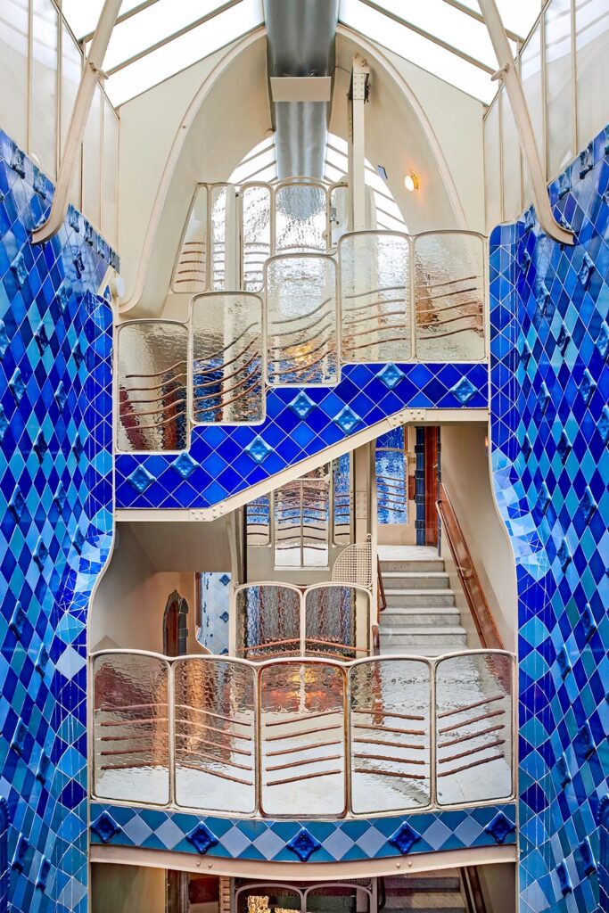 Antoni Gaudí: Biography, Works, Awards 223 Antoni gaudi: casa batlló blue patio stairs and roof arch © david cardelus