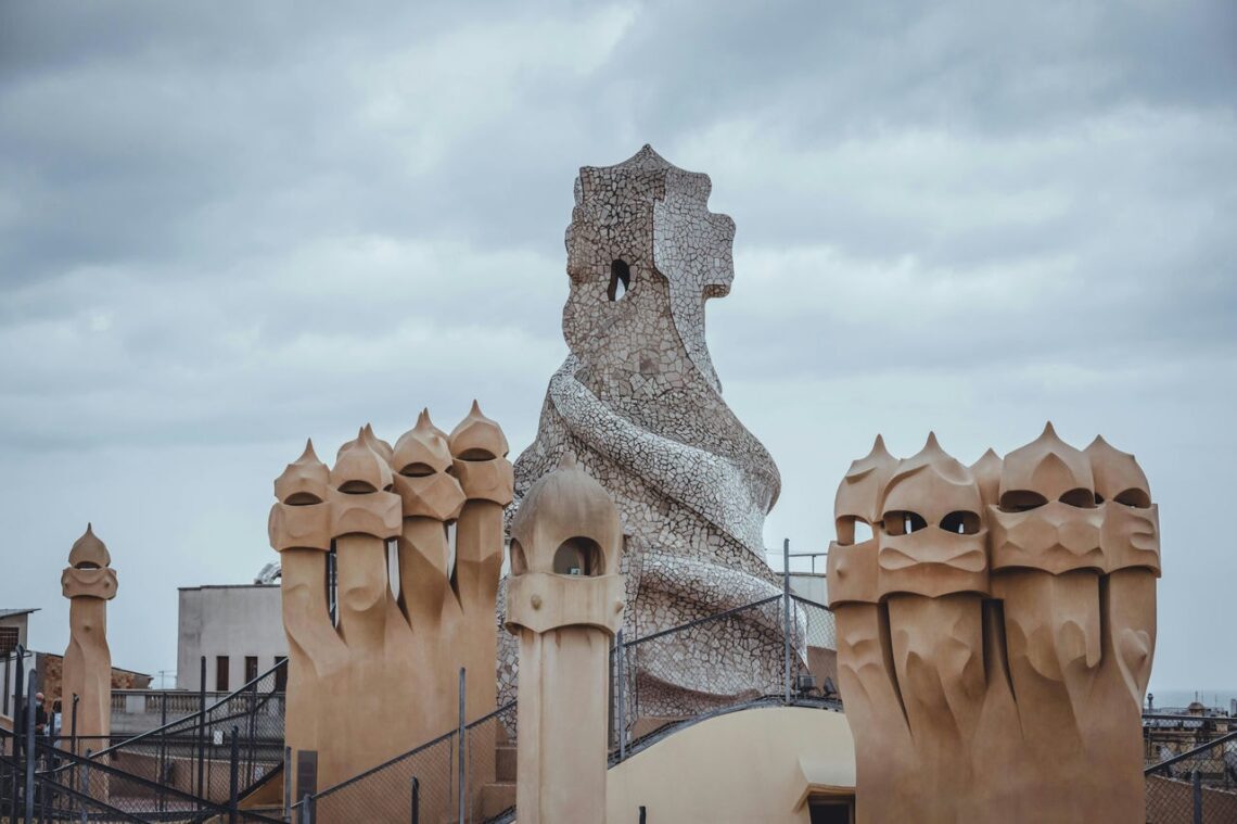Antoni gaudi: casa mila group of chimneys on rooftop © zekai zhu