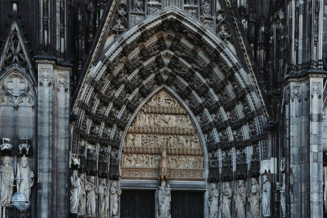 Architectural landmark: cologne cathedral main entrance carvings © masood aslami