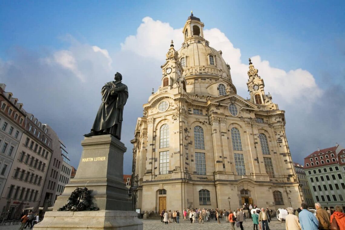 Architectural landmark: frauenkirche dresden, statue of martin luther in front © jorge royan
