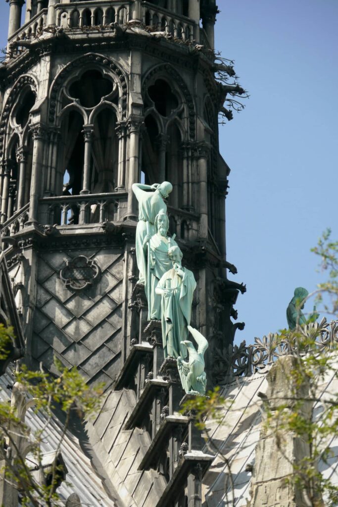 Architectural landmark: notre dame cathedral apostles atop © coralie mercier