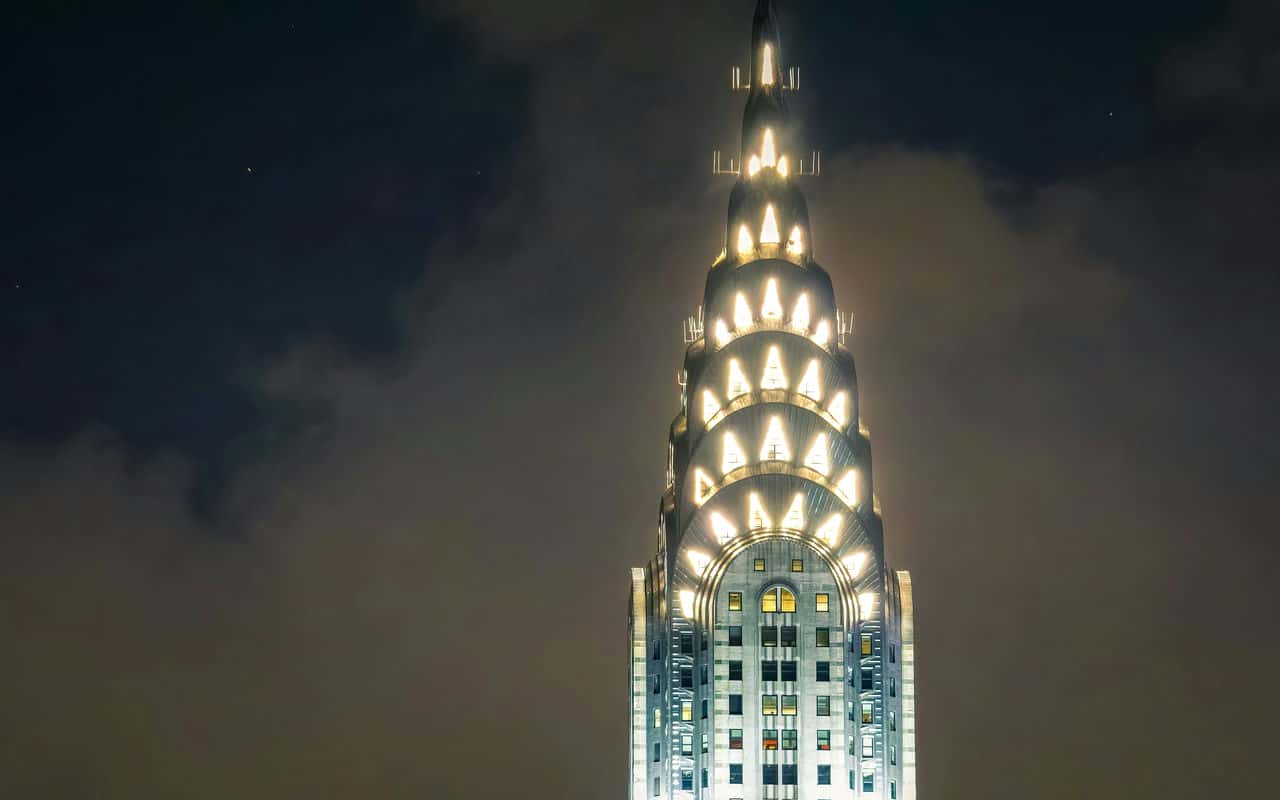Chrysler building crown illuminating at night © clay leconey
