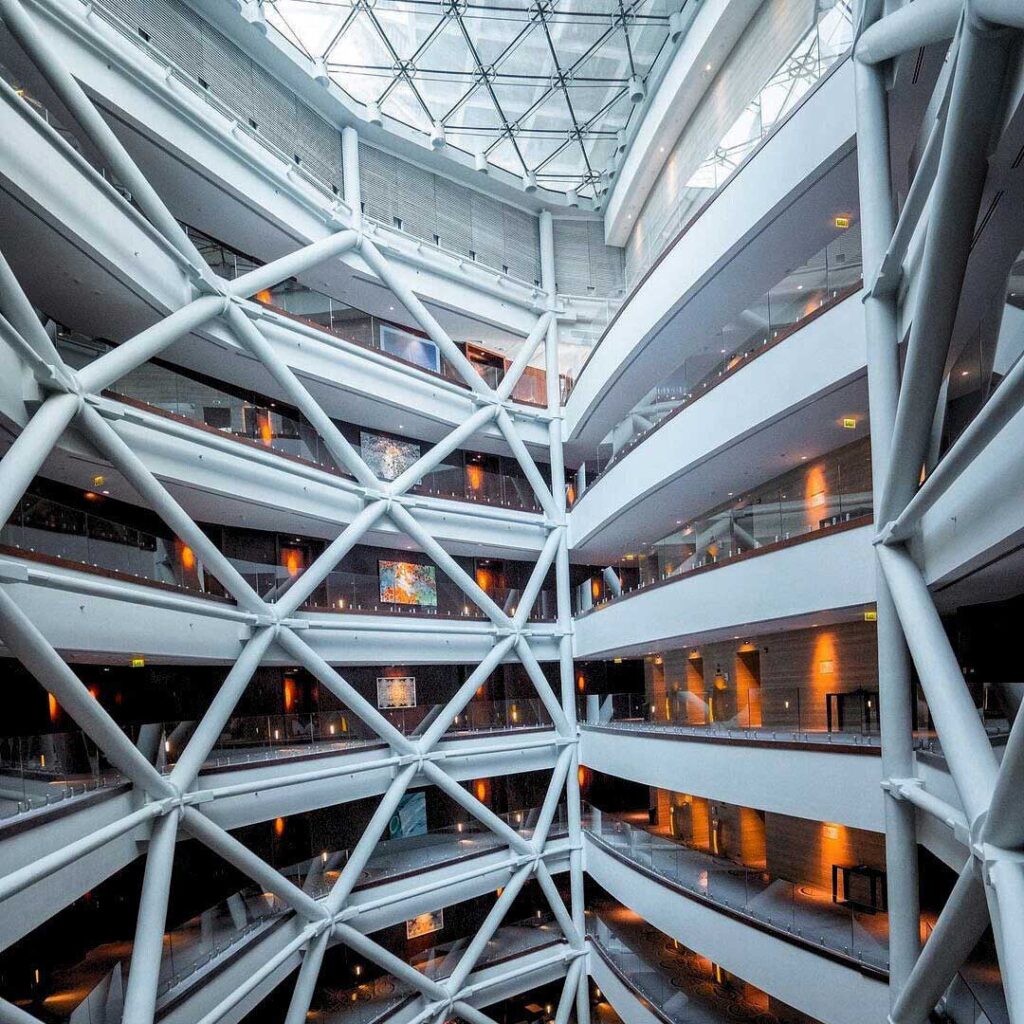 Rmjm: capital gate funnel shaped atrium at the hyatt andaz hotel