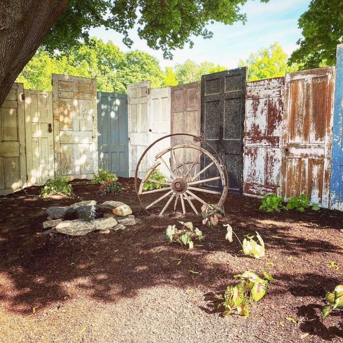 7. Doors upcycled into the colorful fence