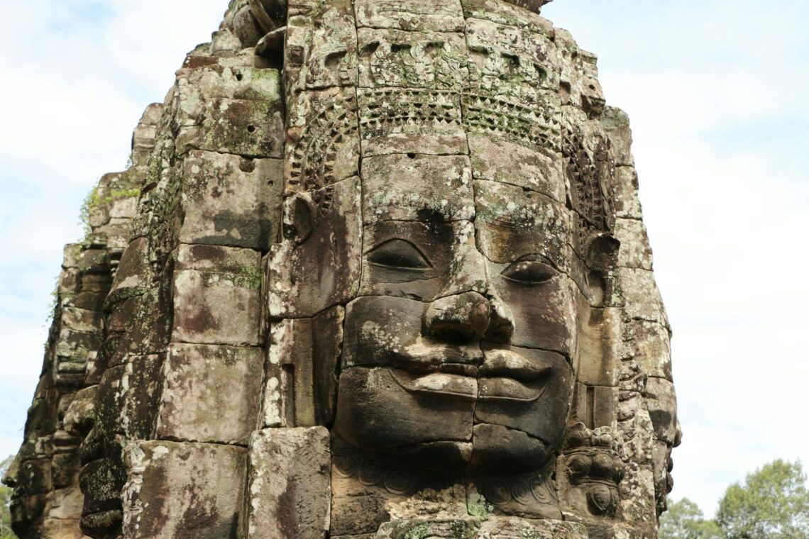Architectural landmark: angkor wat stone face at bayon temple © reena yadav