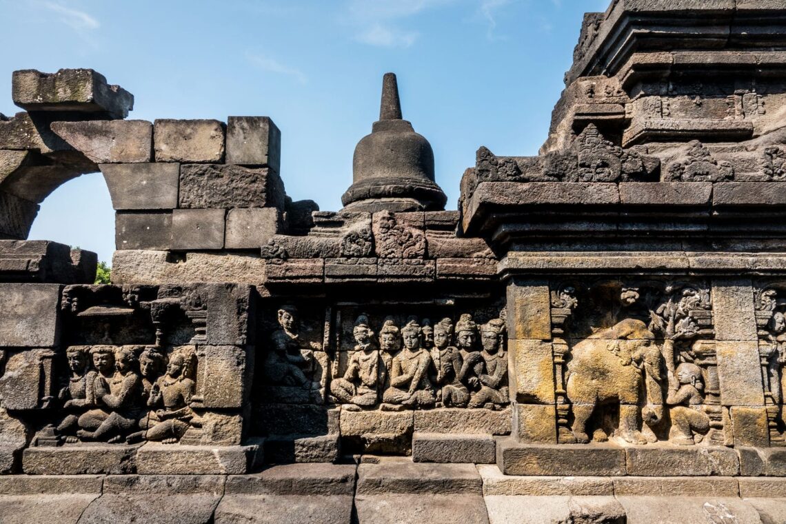 Architectural landmark: borobudur temple carved stone bas-relief sculptures on the terraces © russell scott