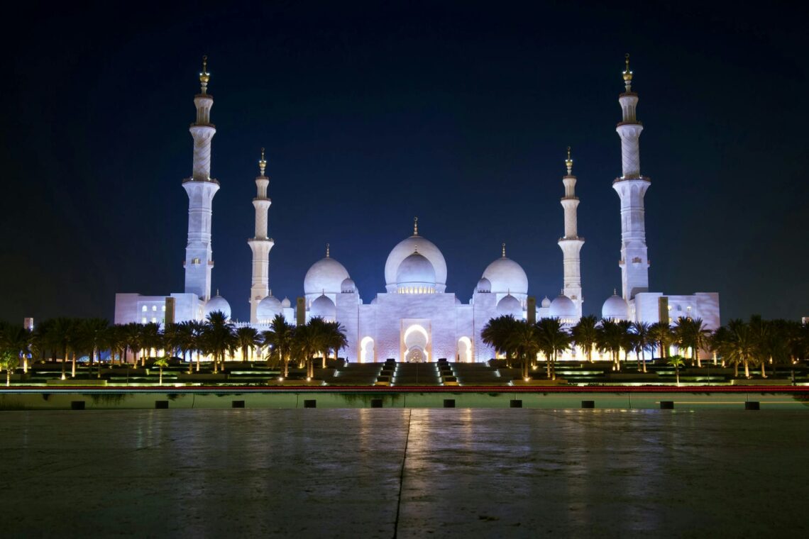 Architectural landmark: sheikh zayed grand mosque façade at night © muhammad ibrahim