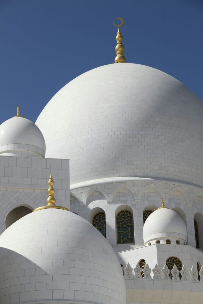 Architectural landmark: sheikh zayed grand mosque closeup of white concrete dome © claude attala