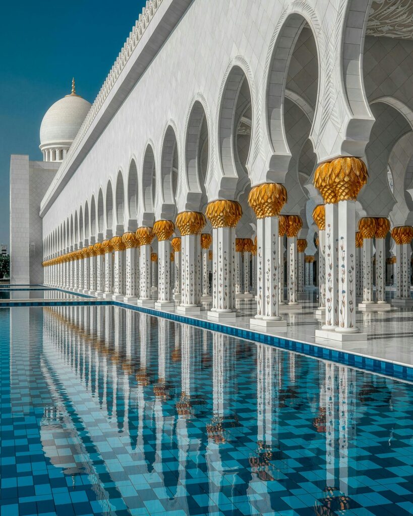 Architectural landmark: sheikh zayed grand mosque reflecting pool and columns © leon macapagal