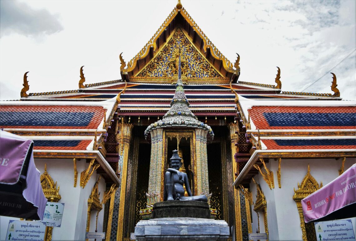 Architectural landmark: the grand palace hermit statue at wat phra kaew © silvia