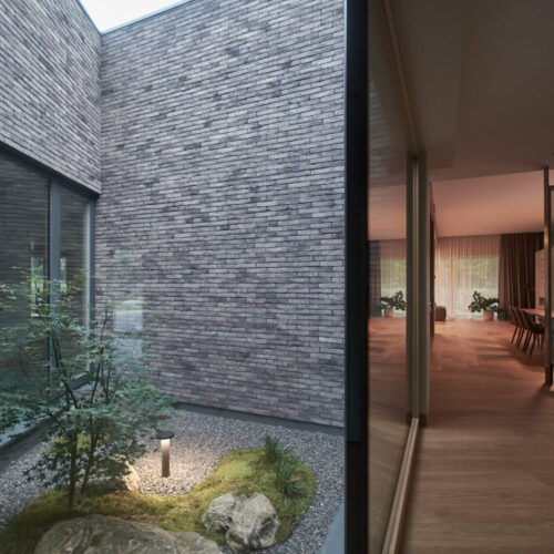 Residential minimalist concrete house / nebrau