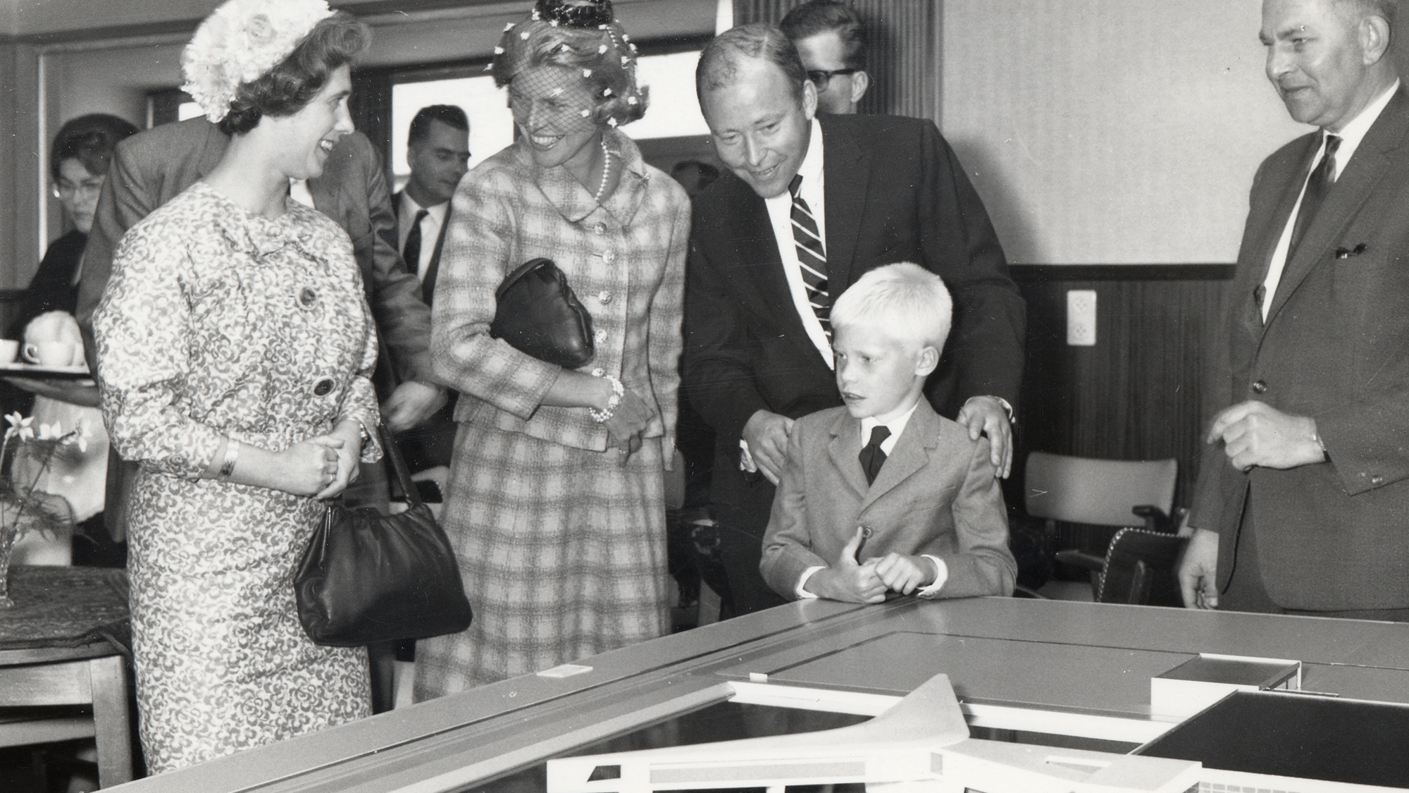 Sam Johnson And His Family Examine An Architectural Model Of Europlant At The Groundbreaking Ceremony In 1963. Sam johnson and his family examine an architectural model of europlant at the groundbreaking ceremony in 1963.