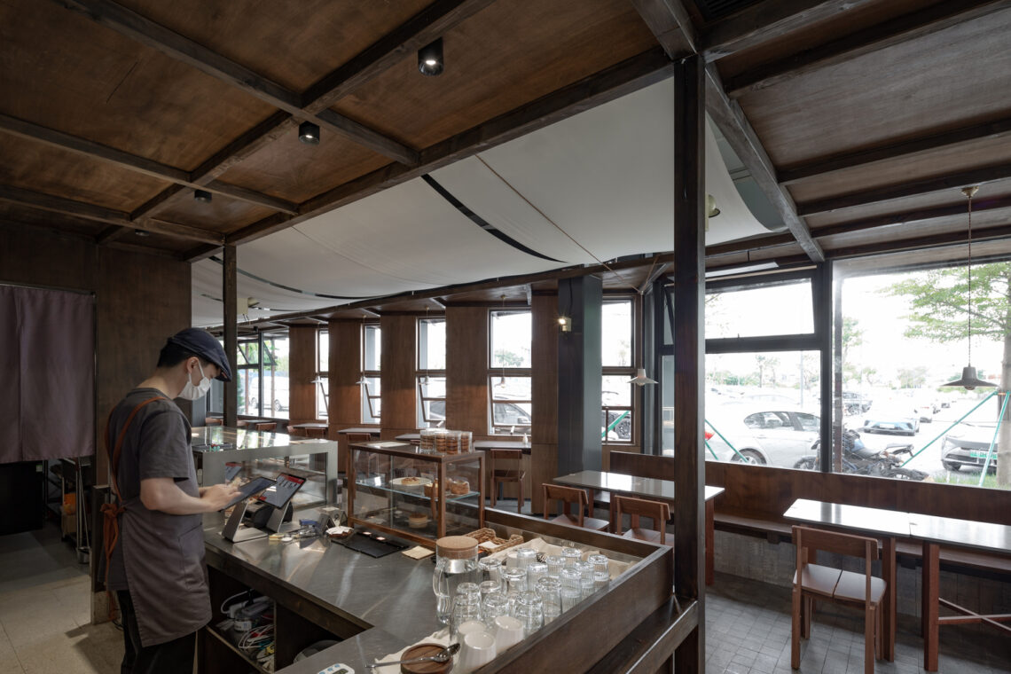 Wooden pavilion by the river - fei patisserie / neme studio architects