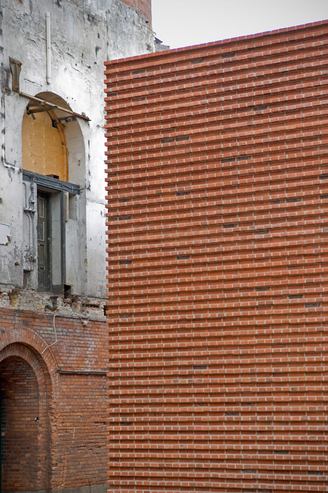 Gottlieb paludan adds four modern brick extensions to old industrial buildings