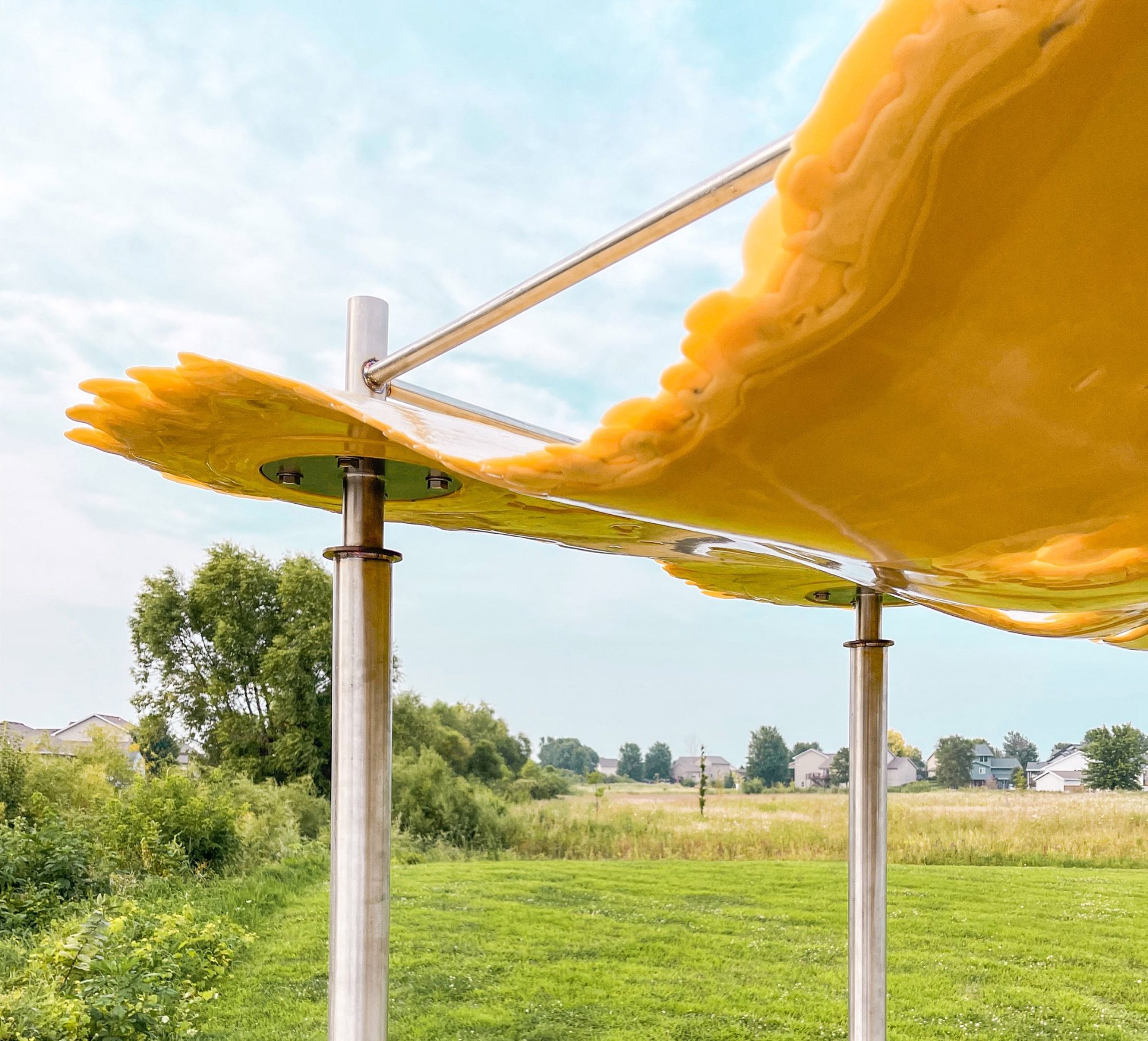 Puddle pavilion by i/thee turns algae bio-resin into public architecture along mud creek