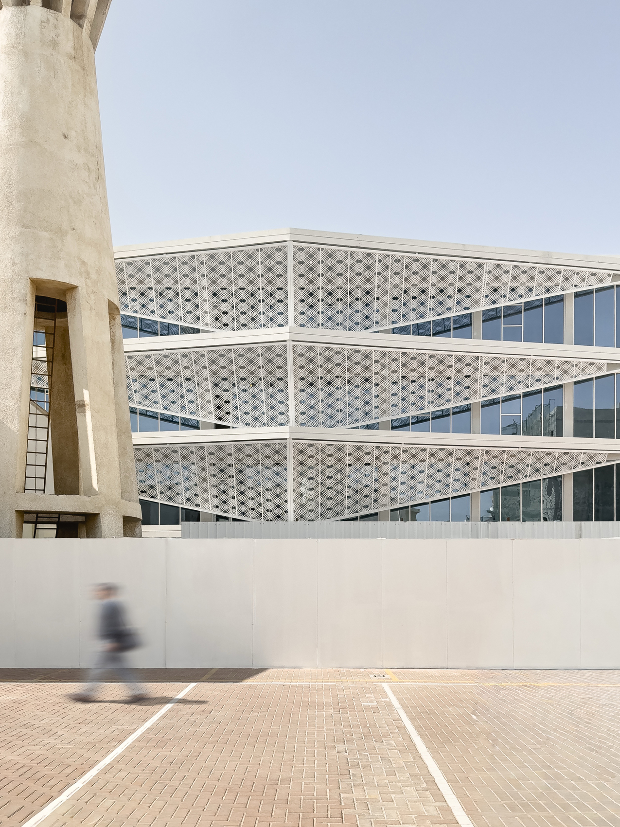 The New Building And Main Facade Behind The 50-Year-Old Water Tower_Reservoir The indonesian consulate in jeddah / inj architects