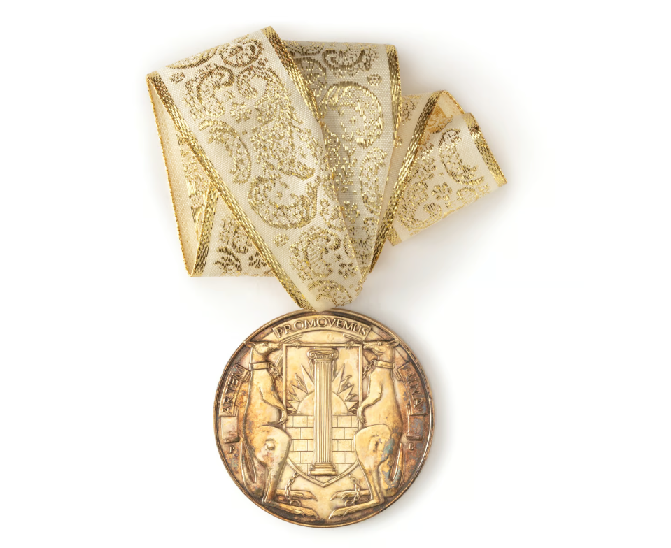 45 Most Prestigious Architecture Awards 38 Royal australian institute of architects medal - gold plated medallion suspended on white and gold ribbon - reverse: royal australian institute of architects (raia) coat of arms of two kangaroos chained and supporting a heraldic shield containing an ionic column, rising sun and masonry wall, legend at top